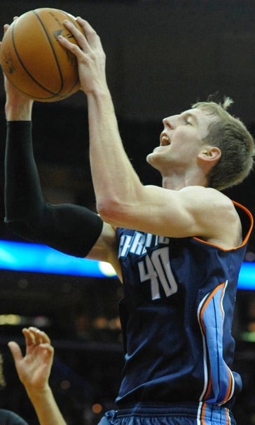 Bobcats clinch playoffs in 96-94 OT win over Cavs